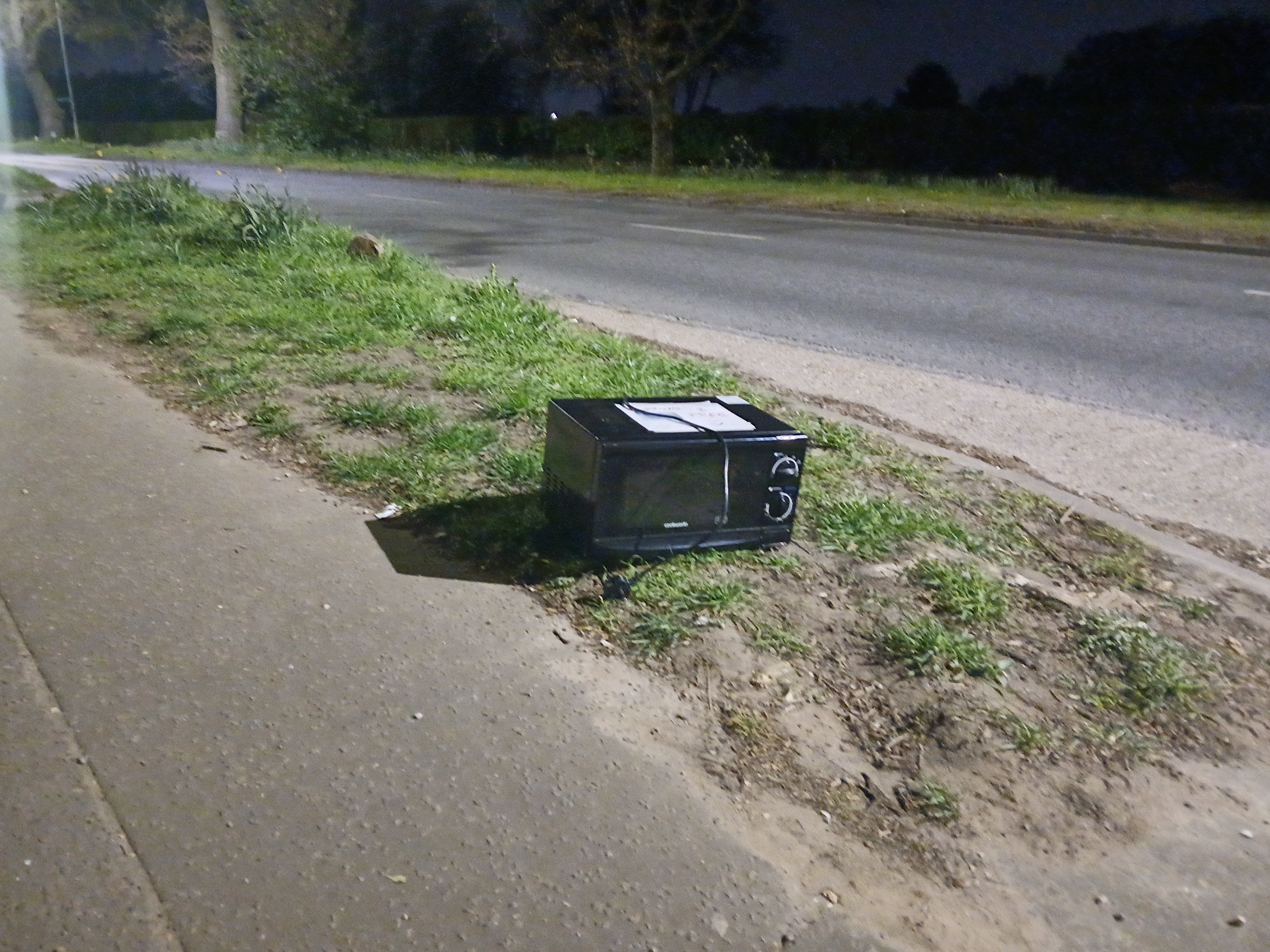 microwave on the side of the road